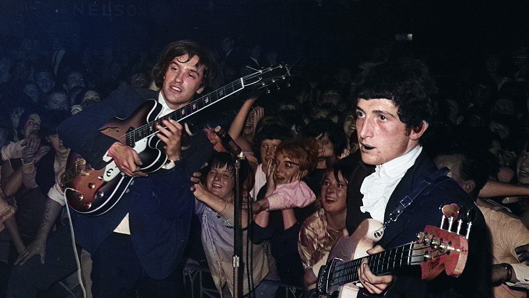 Dave Davies and Pete Quaife of The Kinks pop group on stage during a concert September 1964