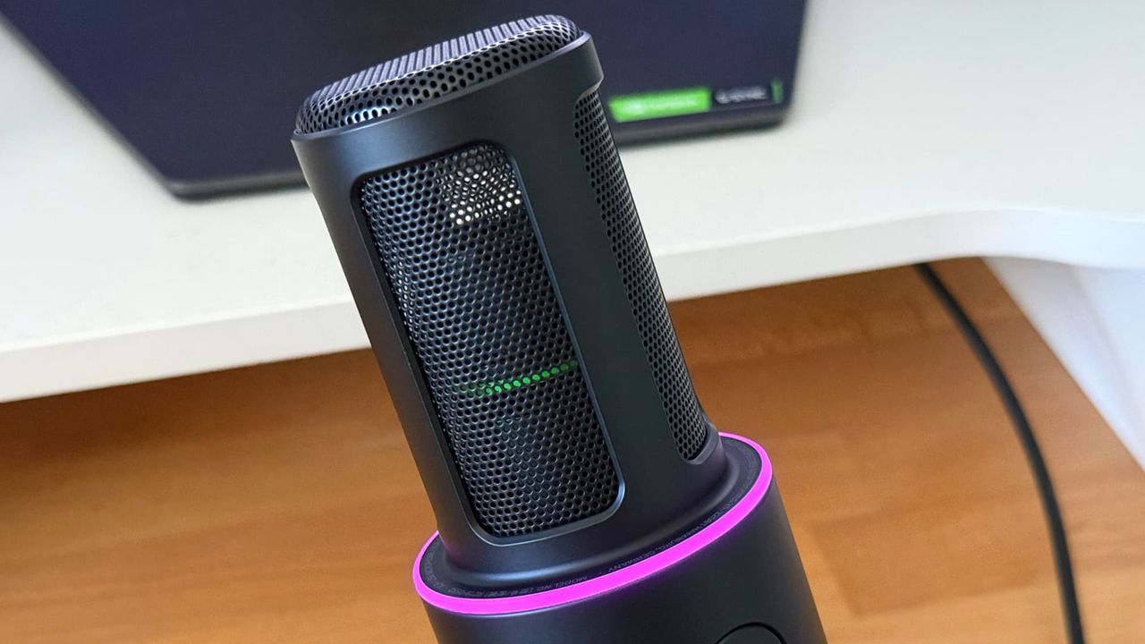 Razer Seiren V3 Pro microphone on wooden desk