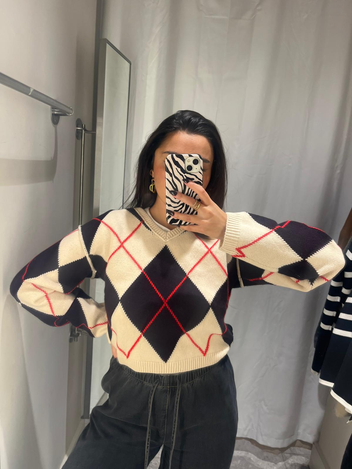 Marina wearing argyle jumper