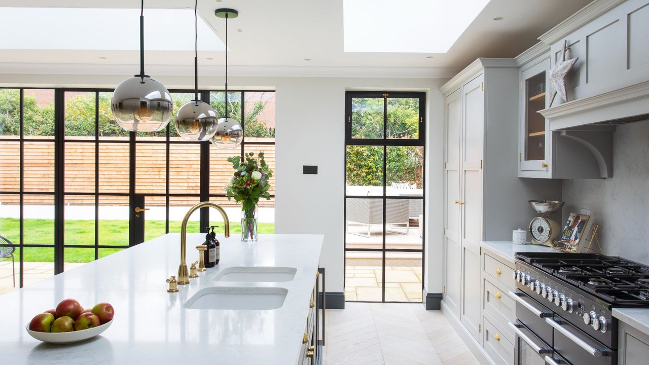 White marble kitchen island in open plan kitchen