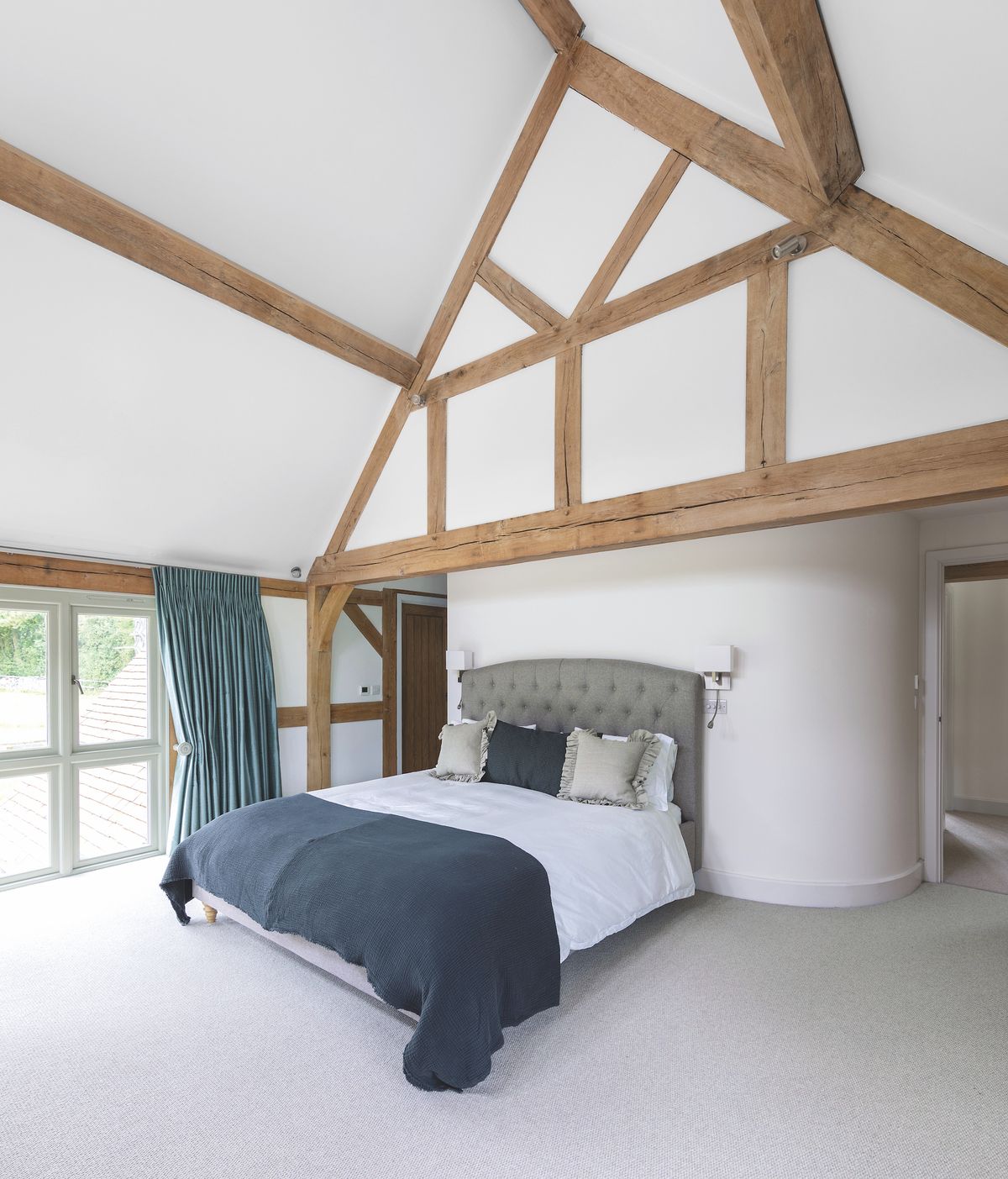 oak frame bedroom with curved wall