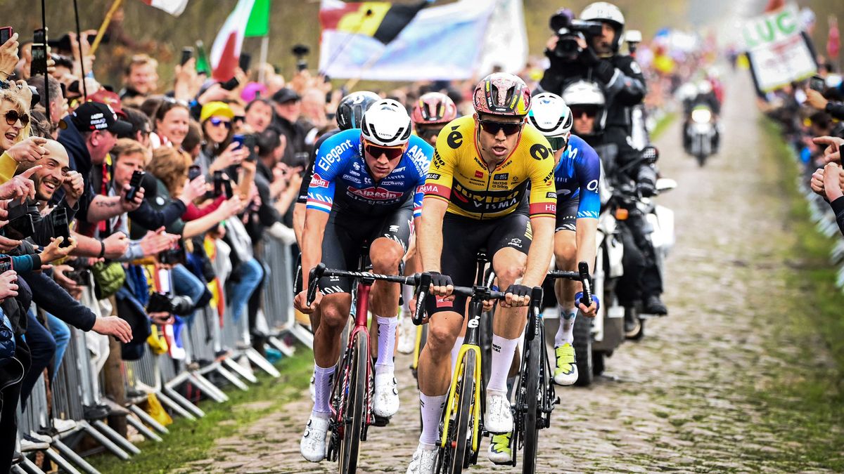 Jumbo-Visma team&#039;s Belgian rider Wout Van Aert (R) and Alpecin-Deceuninck team&#039;s Dutch rider Mathieu Van Der Poel (C) cycle with a pack of riders over the Trouee d&#039;Arenberg cobblestone sector during the 120th edition of the Paris-Roubaix one-day classic cycling race, between Compiegne and Roubaix, northern France, on April 9, 2023. (Photo by FranÃ§ois LO PRESTI / AFP) / &quot;The erroneous mention[s] appearing in the metadata of this photo by Anne-Christine POUJOULAT has been modified in AFP systems in the following manner: BYLINE [Francois Lo Presti] instead of [Anne-Christine Poujoulat]. Please immediately remove the erroneous mention[s] from all your online services and delete it (them) from your servers. If you have been authorized by AFP to distribute it (them) to third parties, please ensure that the same actions are carried out by them. Failure to promptly comply with these instructions will entail liability on your part for any continued or post notification usage. Therefore we thank you very much for all your attention and prompt action. We are sorry for the inconvenience this notification may cause and remain at your disposal for any further information you may require.&quot; (Photo by FRANCOIS LO PRESTI/AFP via Getty Images)