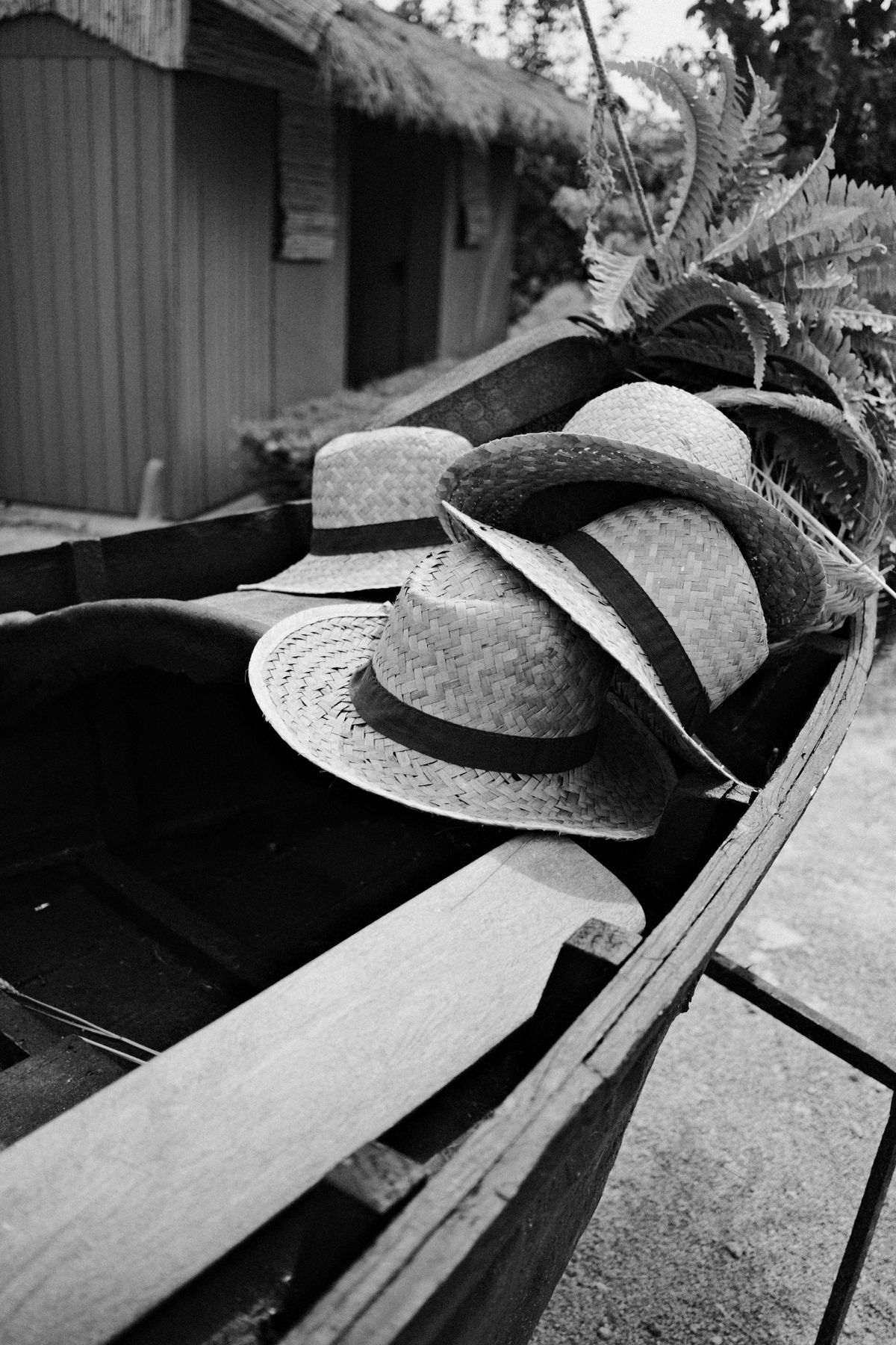 Hats stacked up on the edge of a boat