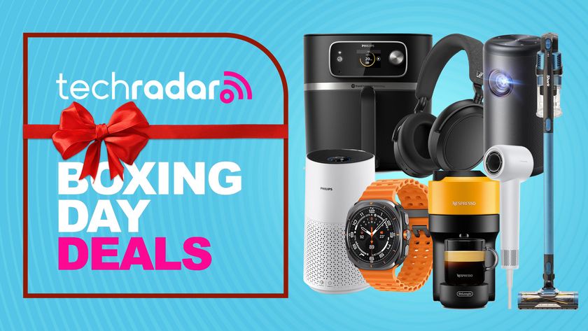 Assortment of tech on a blue background with "Boxing Day deals" text overlay