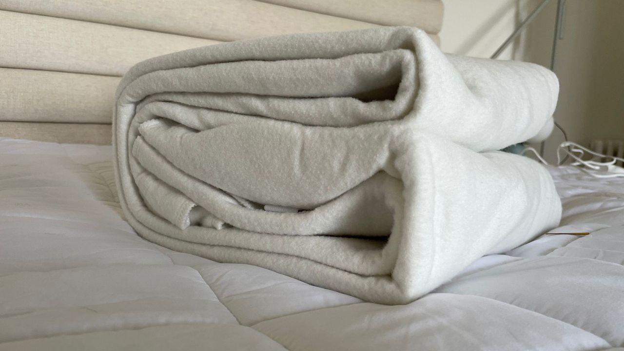 Silentnight Yours&amp;Mine Electric Blanket folded on the bed