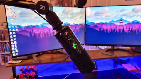 Sennheiser Profile USB Microphone on a Sennheiser boom arm in front of a gaming monitor