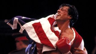 Rocky celebrates with a US flag in Rocky IV