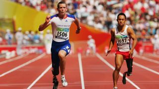 A photo of two Paralympic sprinters racing