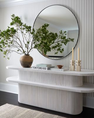 a modern entryway with a stylish console table