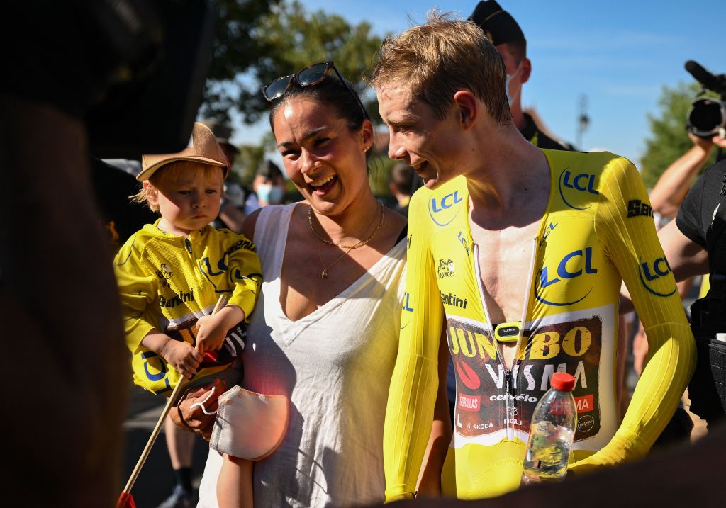 JumboVisma teams Danish rider Jonas Vingegaard wearing the overall leaders yellow jersey R celebrates with his wife and child after the 20th stage of the 109th edition of the Tour de France cycling race 407 km individual time trial between LacapelleMarival and Rocamadour in southwestern France on July 23 2022 Photo by Marco BERTORELLO AFP Photo by MARCO BERTORELLOAFP via Getty Images