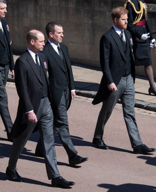 WINDSOR, ENGLAND - APRIL 17: Prince William, Duke of Cambridge, Peter Phillips and Prince Harry during the funeral of Prince Philip, Duke of Edinburgh on April 17, 2021 in Windsor, England. Prince Philip of Greece and Denmark was born 10 June 1921, in Greece. He served in the British Royal Navy and fought in WWII. He married the then Princess Elizabeth on 20 November 1947 and was created Duke of Edinburgh, Earl of Merioneth, and Baron Greenwich by King VI. He served as Prince Consort to Queen Elizabeth II until his death on April 9 2021, months short of his 100th birthday. His funeral takes place today at Windsor Castle with only 30 guests invited due to Coronavirus pandemic restrictions. (Photo by Mark Cuthbert-Pool/UK Press via Getty Images)