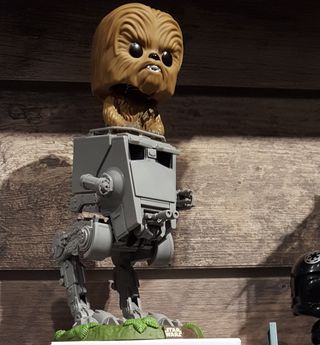 Pop! By Funko's new Chewbacca figurine has the character riding a tiny AT-ST.
