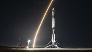 A Falcon 9 rocket waits of the launchpad in Florida to become the 98th and final SpaceX launch of 2023 on Dec. 28