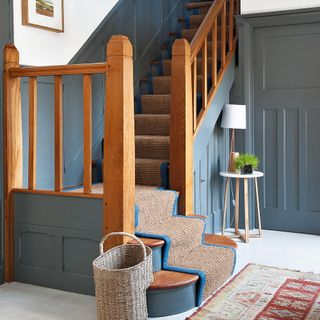 blue staircase with door and carpet floor