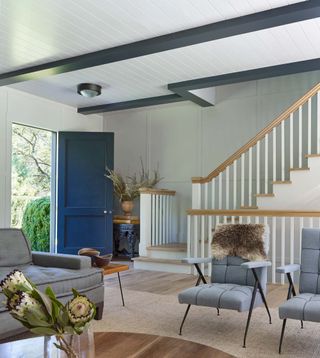 a subtle color change to zone the stairs in an open concept room