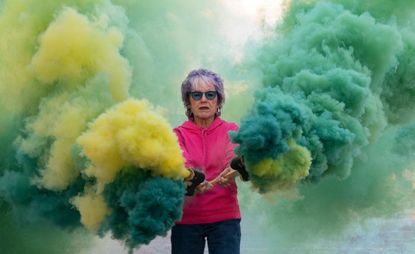 Woman with colour bomb