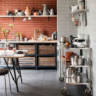 kitchen with iron rack and large format concrete floor tiles