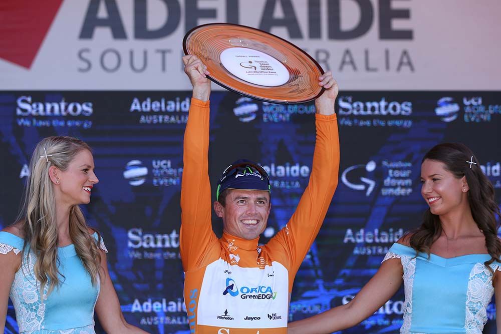 Simon Gerrans (Orica-GreenEdge) lifts the winner's trophy