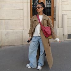 Girl wearing trench coat in Paris