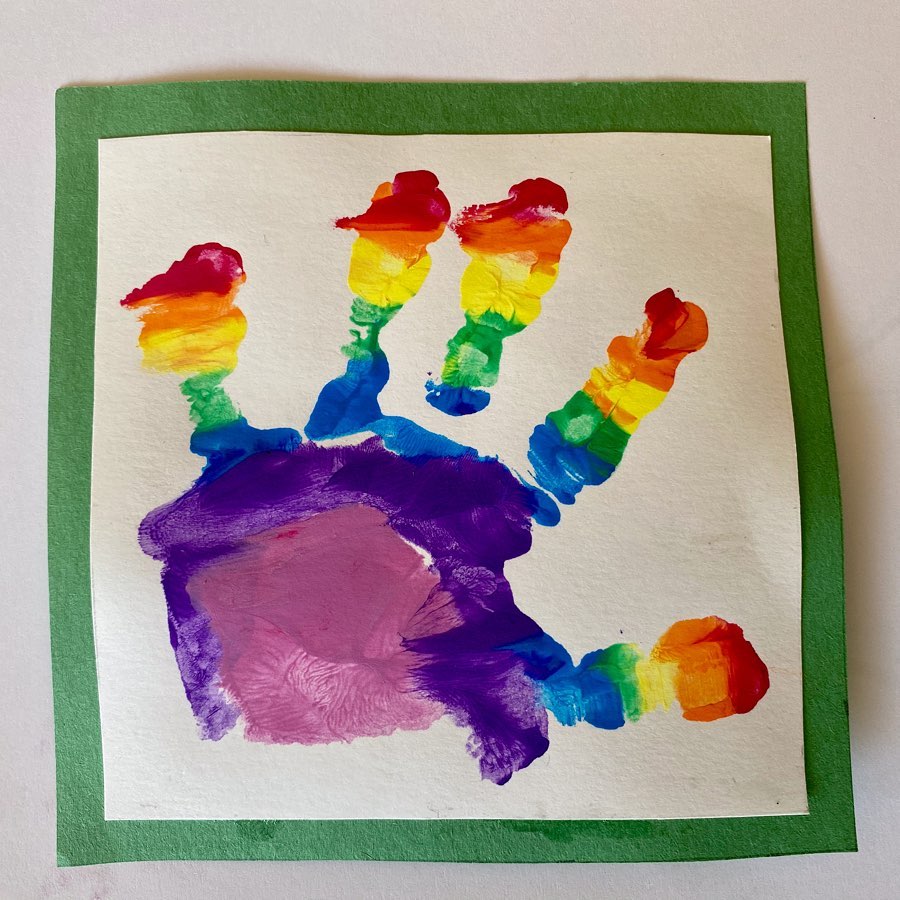 a painting of a rainbow handprint