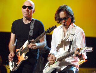 Joe Satriani (left) and Steve Vai perform onstage