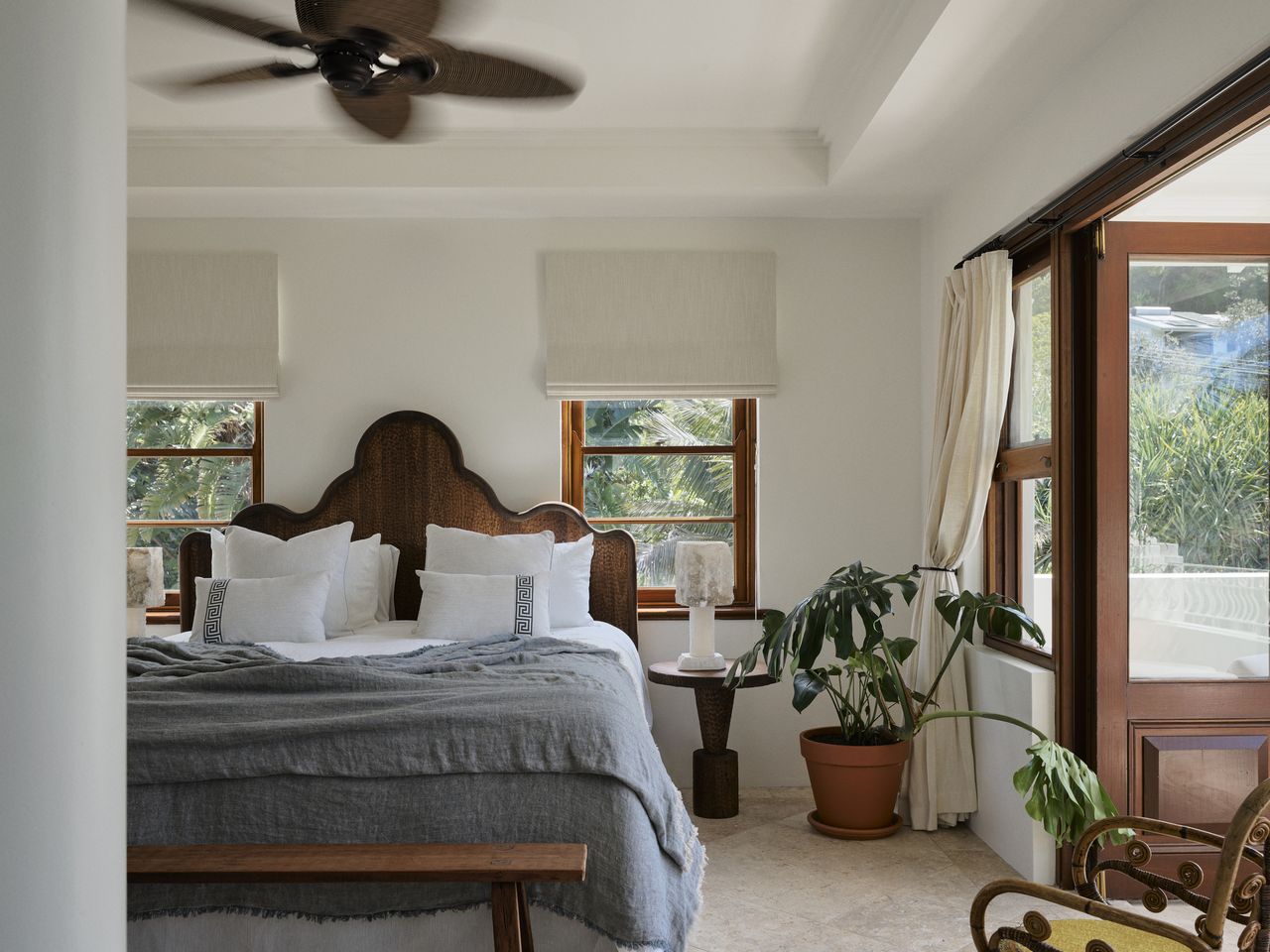 A wood-accented bedroom suite with soft blue bedsheets
