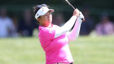 Megan Khang plays an iron shot