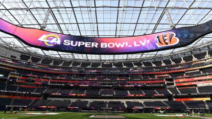 A large screen inside SoFi Stadium shows the Super Bowl matchup between the L.A. Rams and Cincinnati Bengals