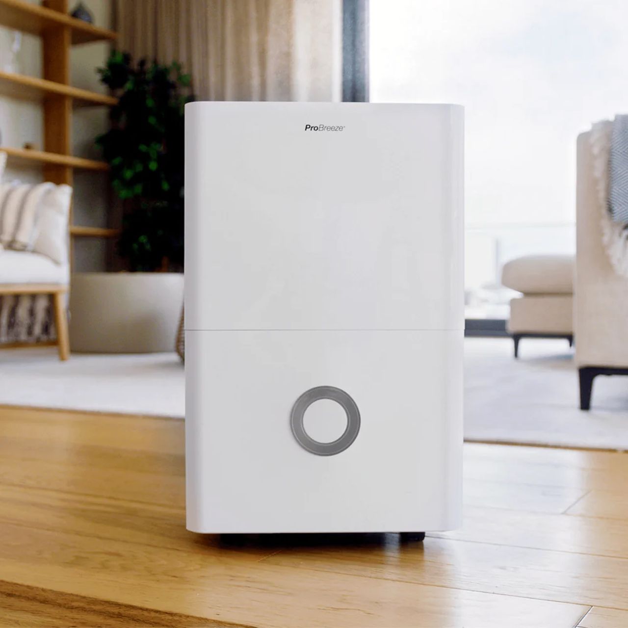 The Pro Breeze 30L High Capacity Smart Dehumidifier in a modern interior with a wood floor