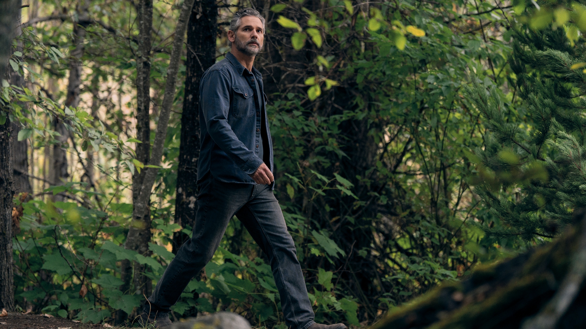 Kyle walks through the park in Untamed