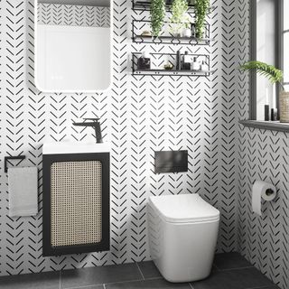 black and white bathroom with small vanity unit and sink combination