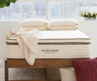 Avocado Organic Mattress Topper on a bed.