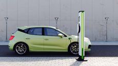 green electric vehicle at charging station