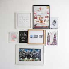 room with frames on white wall
