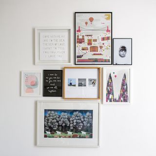 room with white wall with frame