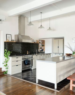 kitchen with white cabinets and black and grey checkerboard floor