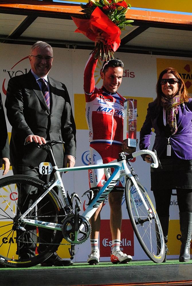 Joaquim Rodriguez (Katusha), winner of the 2012 WorldTour individual ranking, receives his champion's trophy from UCI president Pat McQuaid at the Volta Ciclista a Catalunya.