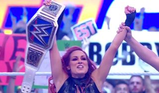 Becky Lynch holding the championship WWE