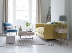 living room with white scheme and yellow sofa by loaf