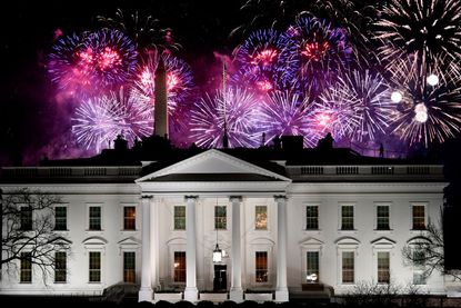 Fireworks explode over the White House.