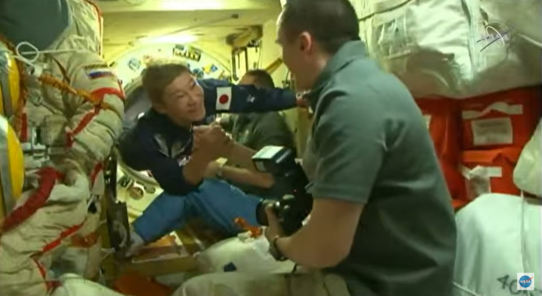 Japanese entrepreneur Yusaku Maezawa enters the International Space Station to begin a 12-day space tourist trip following a Soyuz launch and docking on Dec. 8, 2021.