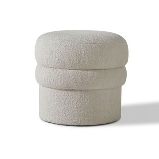 A white boucle fabric stool for sustainable furniture brands.