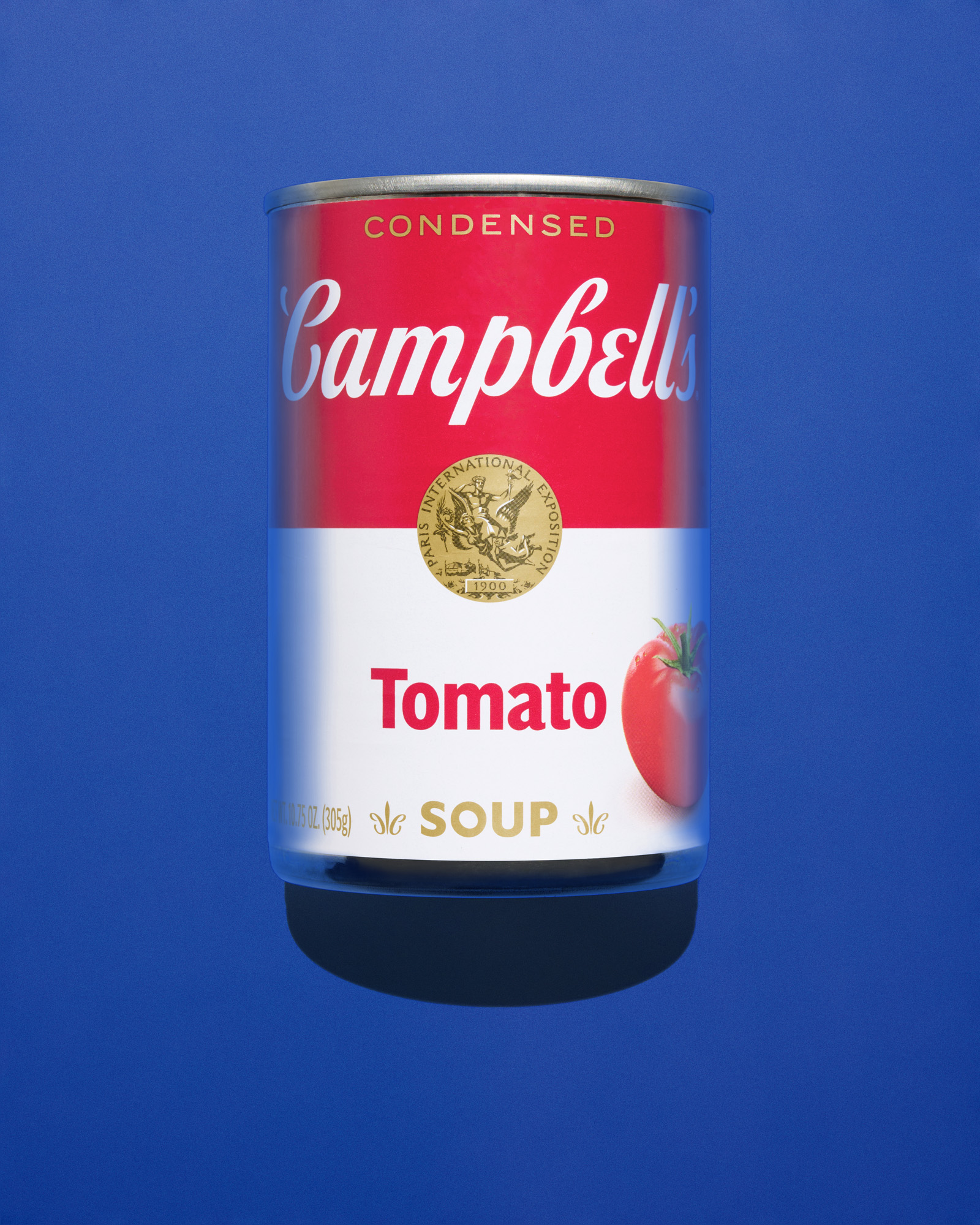 campbells soup can against a blue background