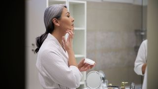 Woman applying cleanser