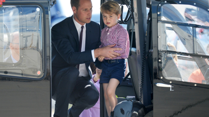 Prince George of Cambridge, Prince William, Duke of Cambridge look in a helicopter as they depart from Hamburg airport on the last day of their official visit to Poland and Germany on July 21, 2017 in Hamburg, Germany.