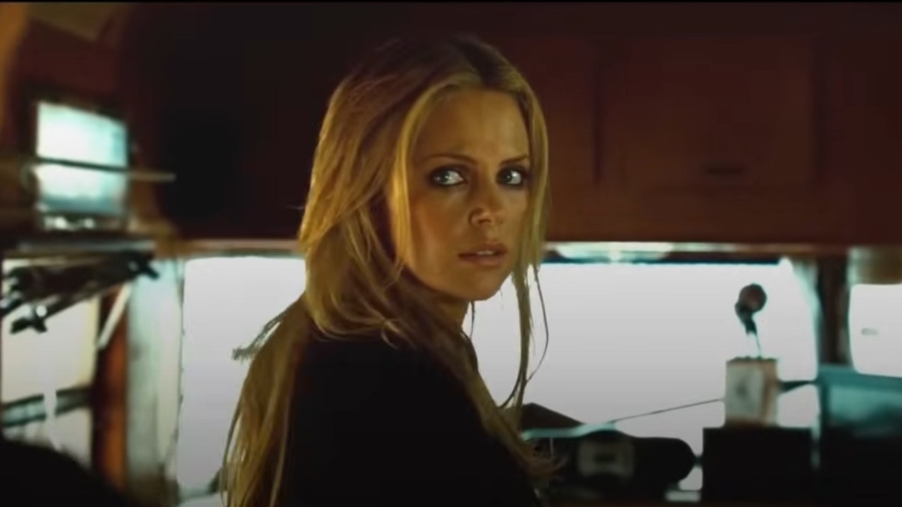 Charlize Theron looking over her shoulder in Hancock