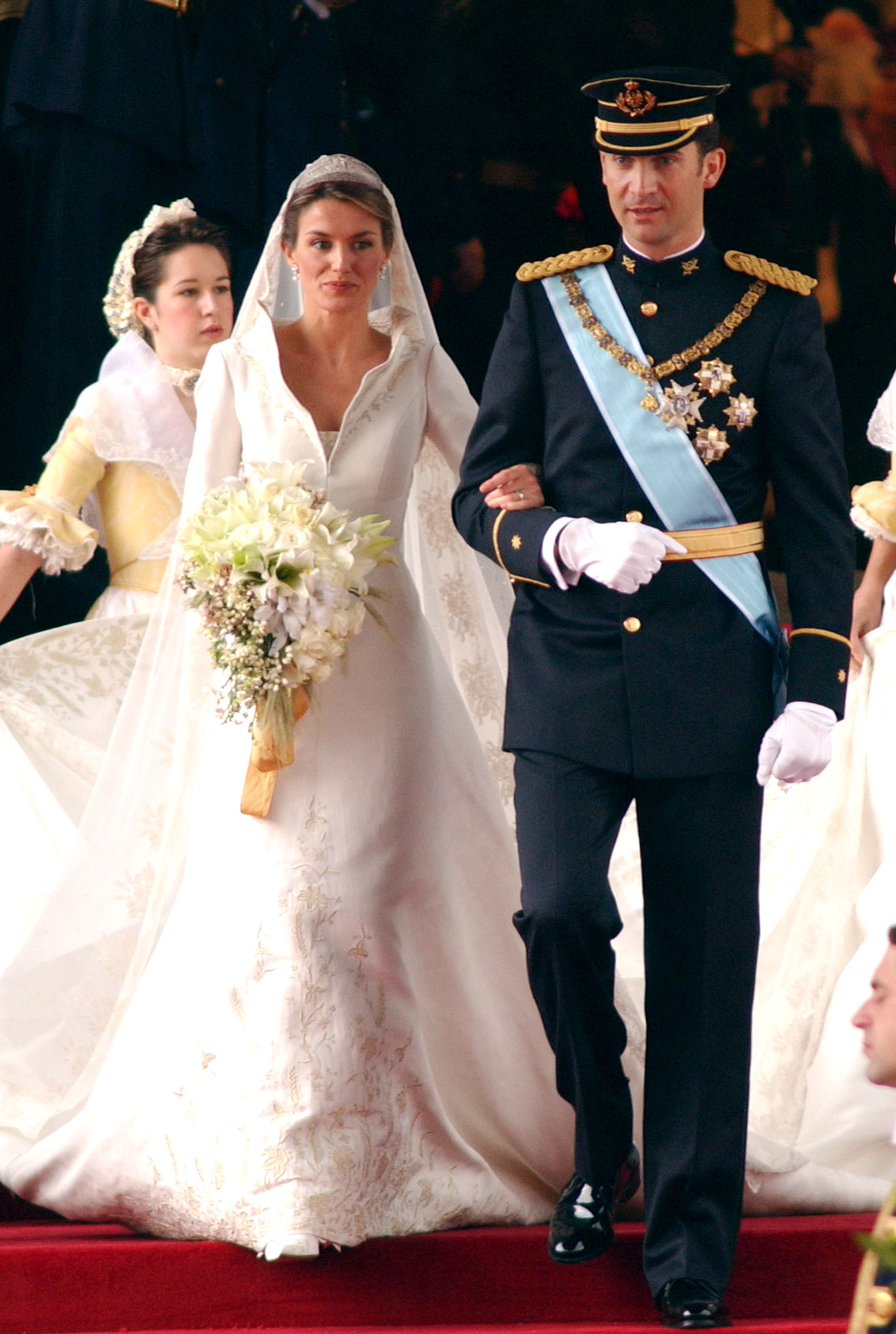 Queen Letizia on her wedding day walking down the aisle with King Felipe