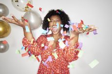 Woman celebrating with party decorations