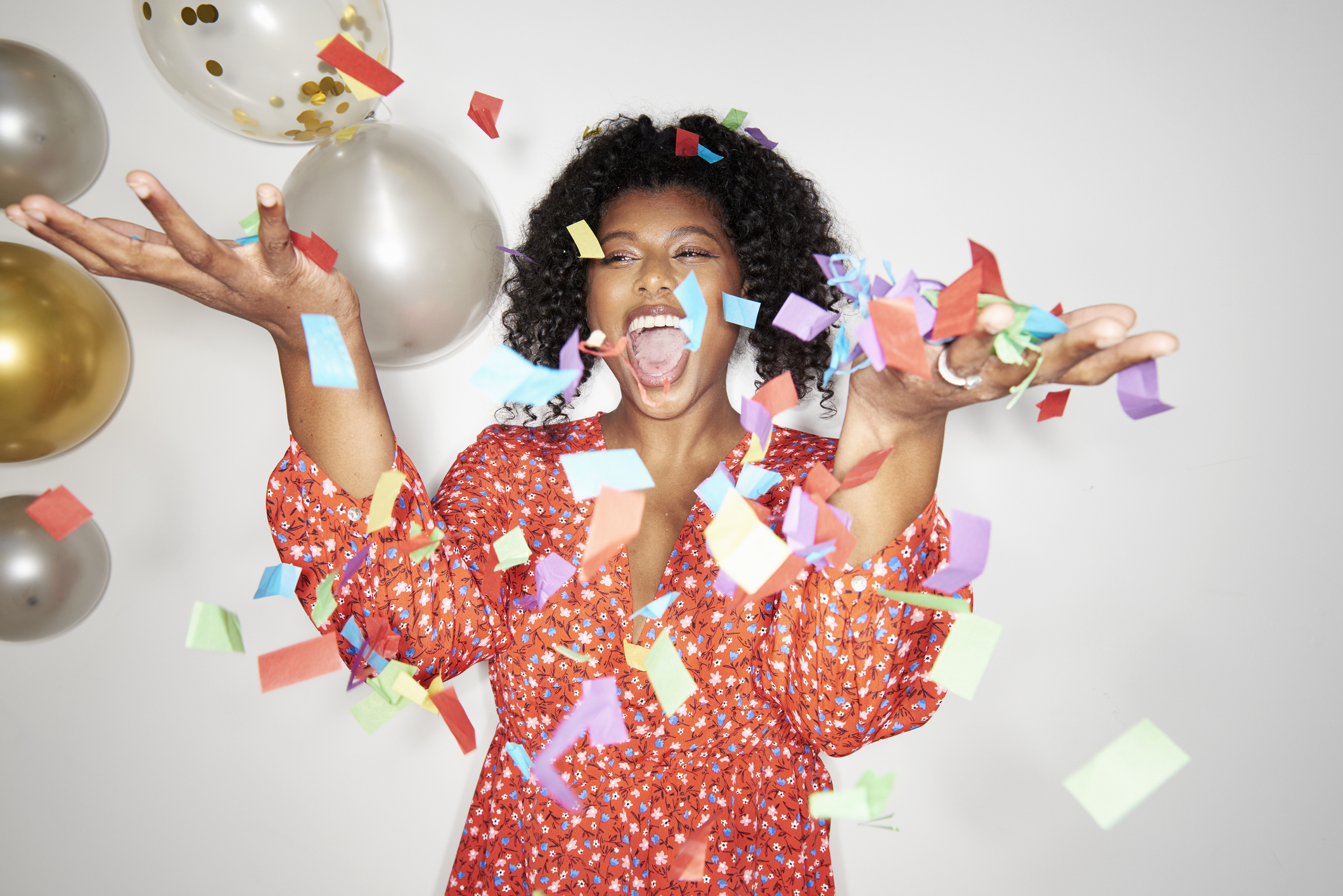 Woman celebrating with party decorations