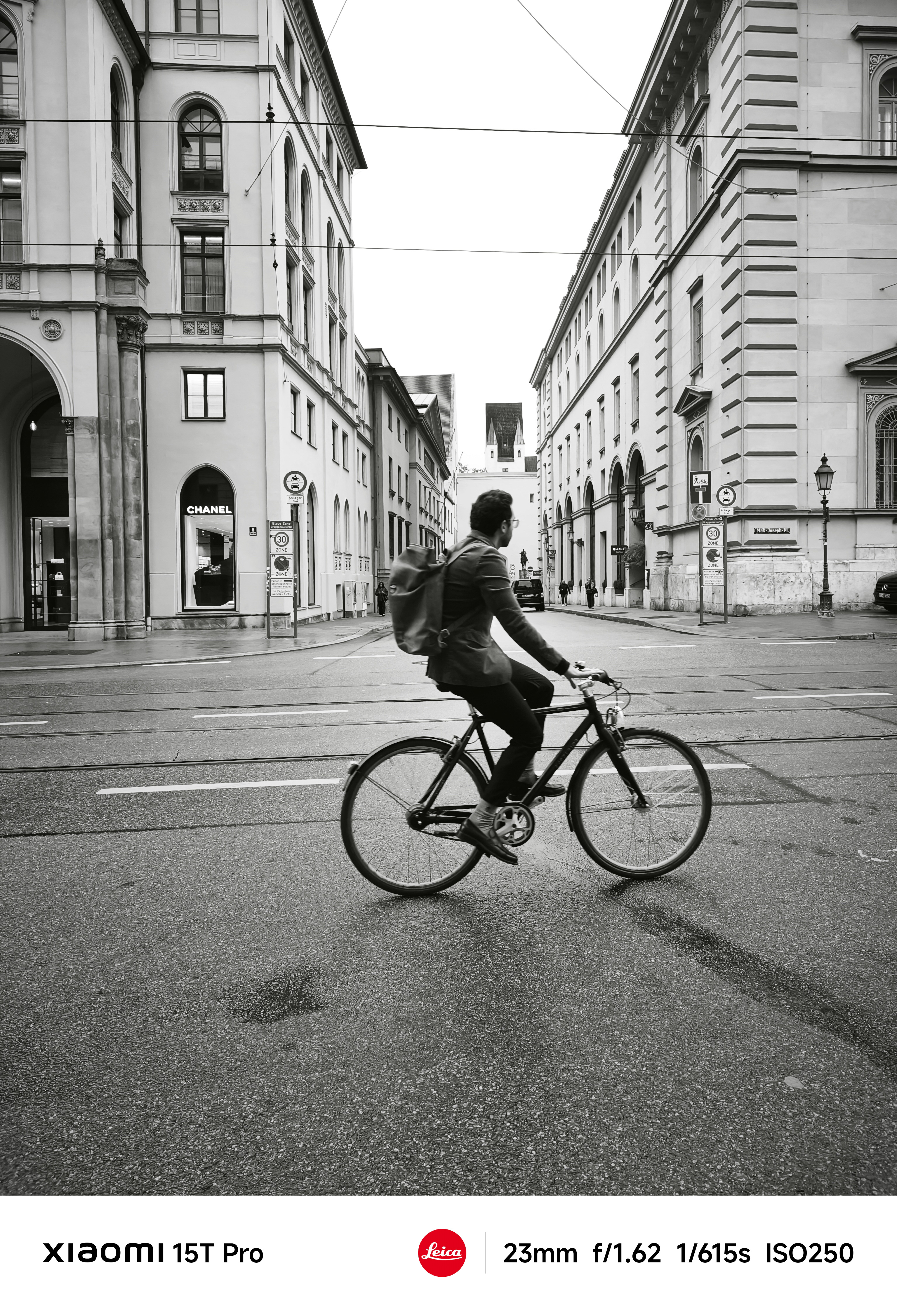 A person cycling across a street in Munich Germany